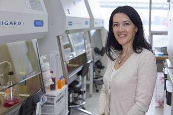 Rockefeller researcher Theodora Hatziioannou stands inside a laboratory